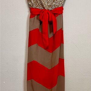 Gold and Orange Chevron strapless dress. Gold sequins bodice w/sheer skirt.